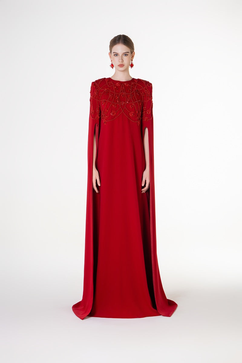 Red velvet satin maxi dress with round neckline by Tracy Studio, featuring a flowing silhouette and elegant design.