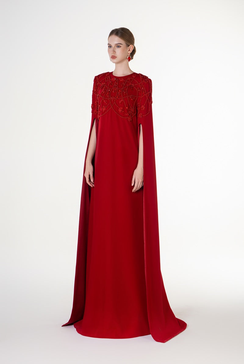 Red velvet satin maxi dress with a round neck by Tracy Studio, featuring a flowing silhouette and elegant design.