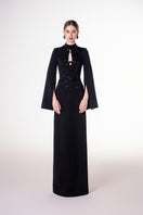 Black velvet satin floor-length gown by Tracy Studio featuring elegant draping and a fitted silhouette.