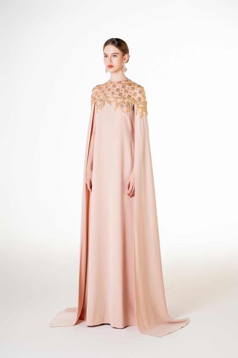 Apricot velvet satin maxi dress by Tracy Studio, featuring a flowing design and elegant fabric, shown on a model.