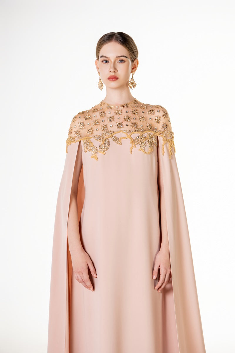 Apricot velvet satin maxi dress from Tracy Studio featuring a flowing silhouette and elegant design.