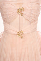 Elegant JOSÉPHINE LUNA gown featuring flowing fabric and intricate design, perfect for formal occasions.