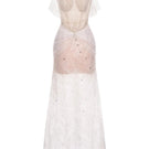 Elegant white Joséphine Stella gown with flowing fabric and detailed neckline, perfect for formal occasions.