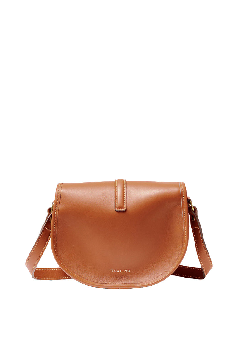 Tan TUSTING Cardington shoulder bag with adjustable strap and sleek design, shown from the side view.