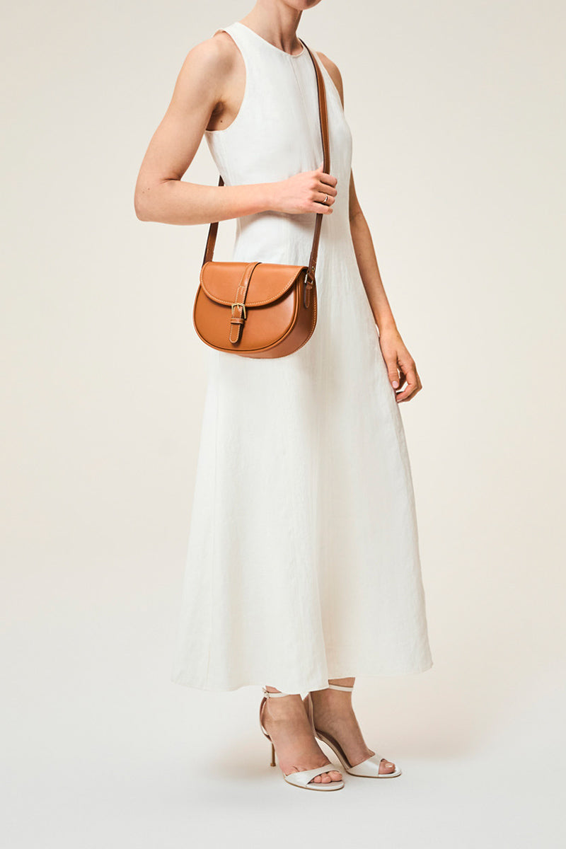 Tan TUSTING Cardington shoulder bag with adjustable strap and stylish design, shown in a close-up view.