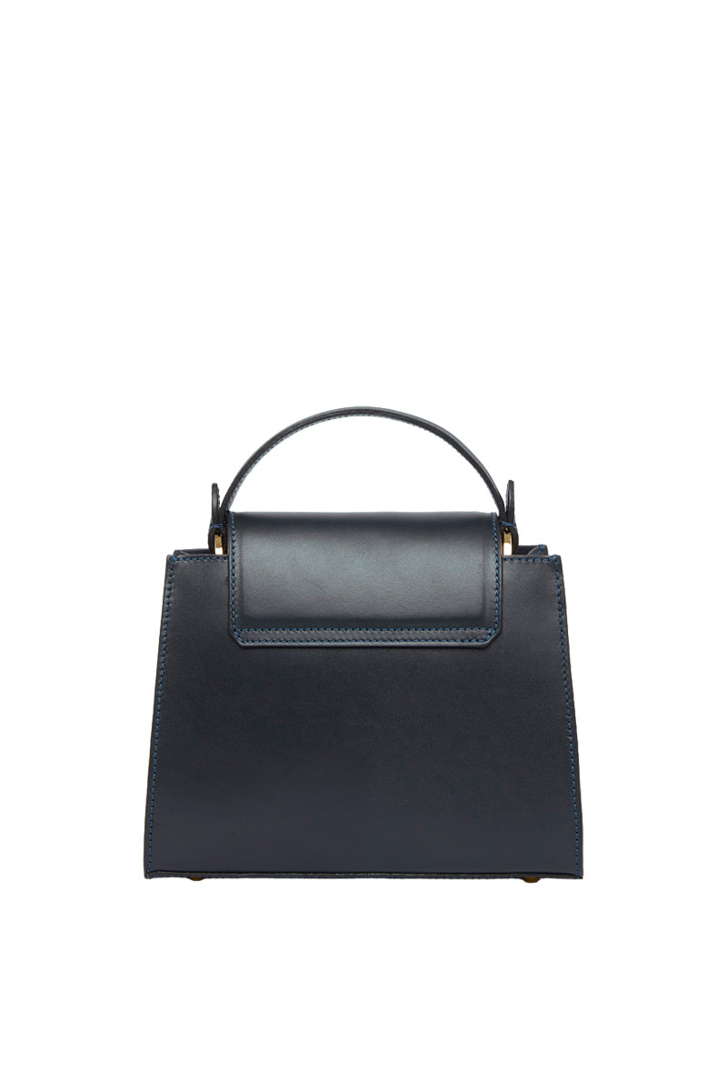 Navy blue TUSTING Clara top handle bag with sleek design and structured shape, featuring a sturdy top handle and elegant finish.