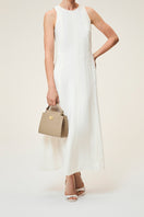 TUSTING Clara taupe top handle bag with structured design and elegant leather finish, featuring a short handle and minimalist style.
