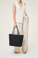 Black TUSTING Canvas Easy Tote shoulder bag with sturdy handles and spacious interior, ideal for everyday use.