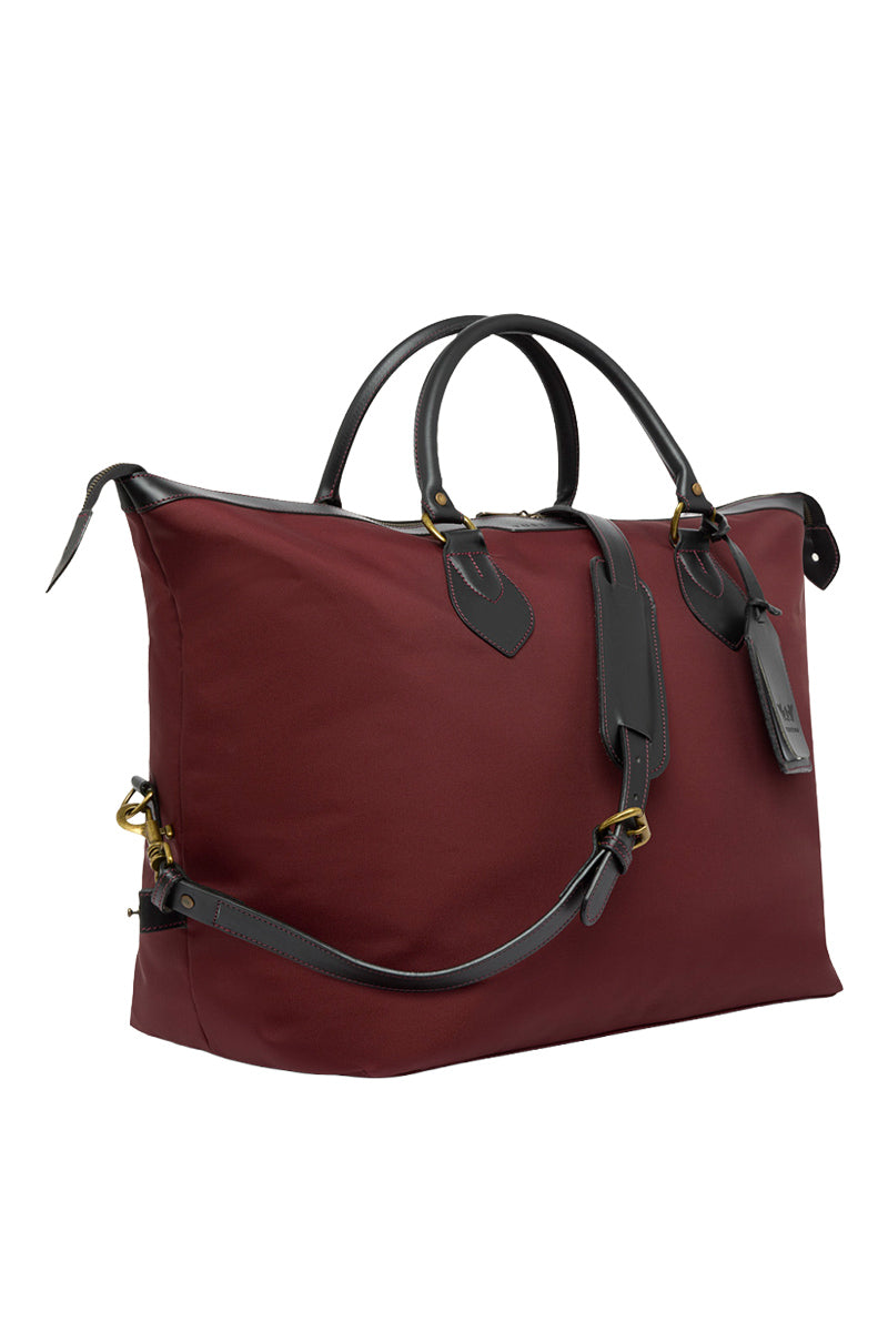 TUSTING Superlight Explorer medium top handle bag in black with sleek design and sturdy handle, ideal for travel and daily use.