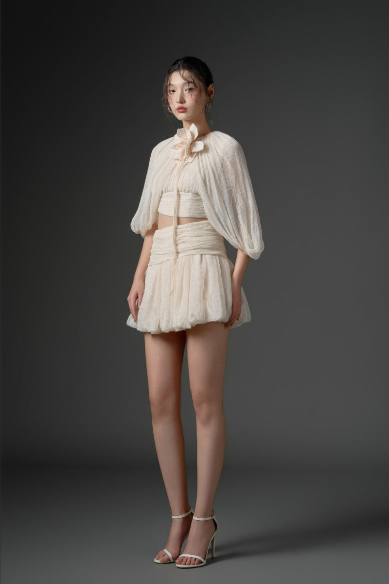 Beige QIRSH silk cut-out mini dress by 21Six, featuring elegant fabric and stylish design, displayed on a mannequin.