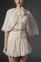 Beige silk cut-out mini dress from 21Six QIRSH collection, featuring stylish design and elegant fit.
