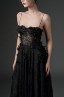 Black Ghazal lace strappy midi dress by 21Six, featuring intricate lace details and a fitted silhouette.
