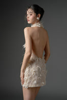 Beige mini dress by 21Six with lace, floral embroidery, and feather details, featuring a stylish, feminine design.