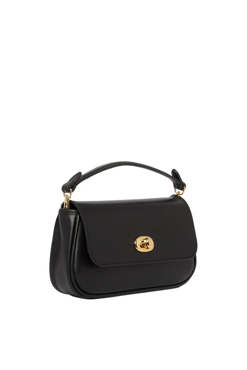 Black TUSTING Hettie clutch purse with zipper closure, stylish accessory for evening and formal occasions.