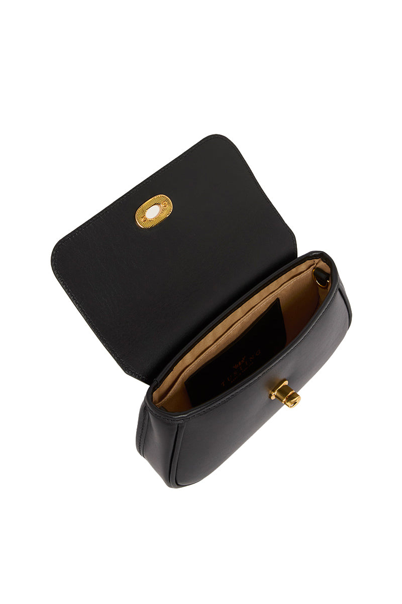Black TUSTING HETTIE clutch bag with sleek design and silver clasp, featuring a compact, elegant silhouette for evening occasions.