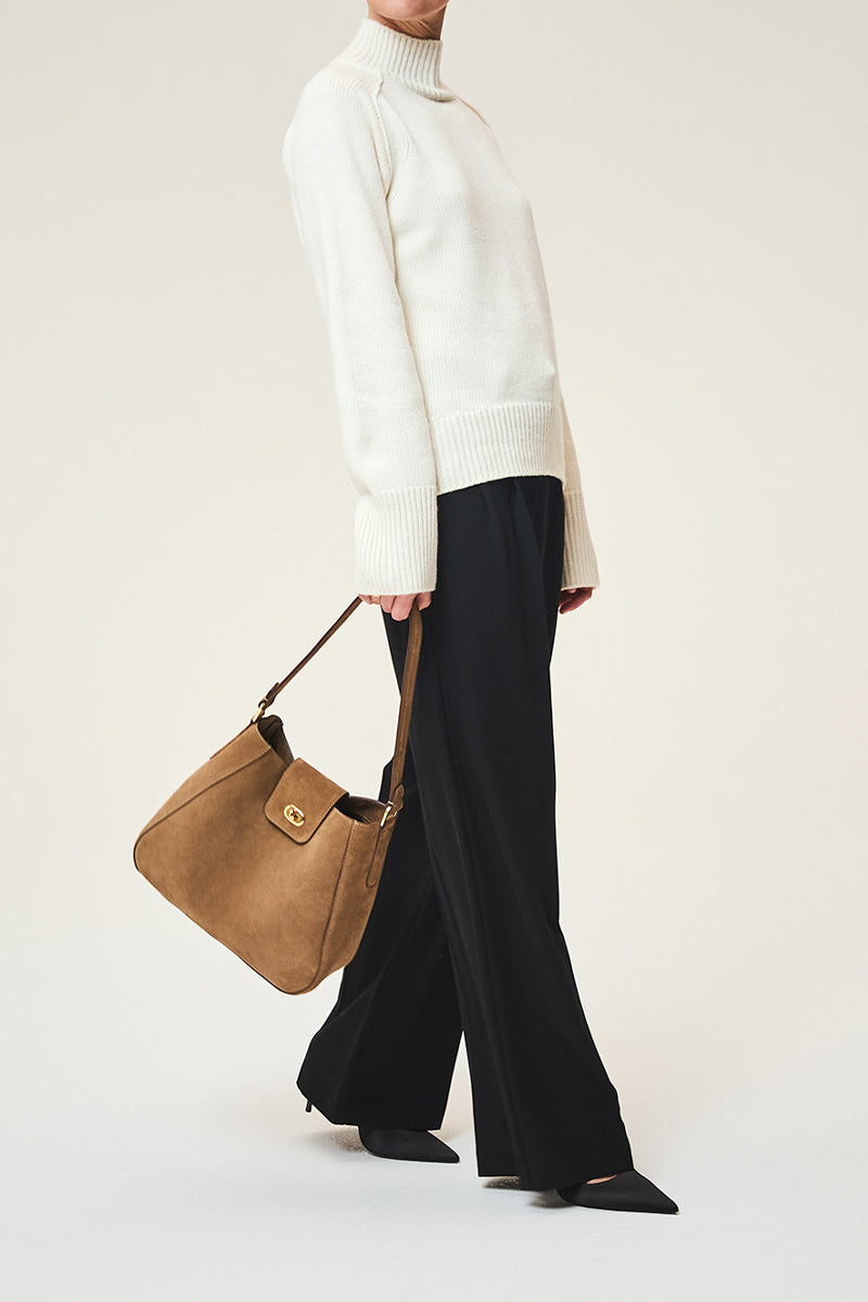 TUSTING Hazel in Date suede shoulder bag with adjustable strap and minimalist design, featuring soft textured material.