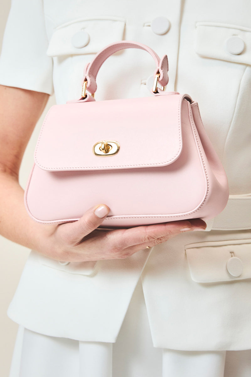 TUSTING Mini Holly in Blossom top handle bag with floral design and structured shape, perfect for stylish everyday use.
