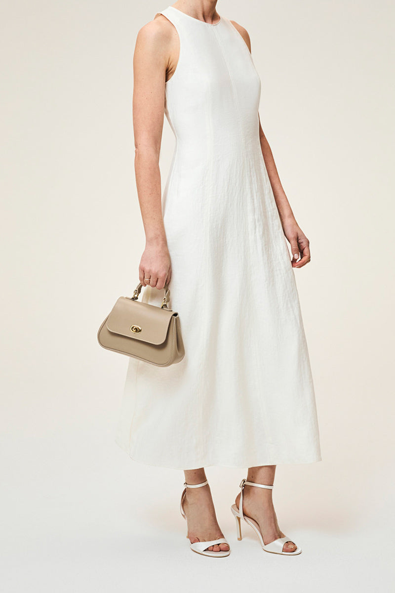 Mini Holly taupe top handle bag by TUSTING with sleek design and structured shape, perfect for stylish everyday use.