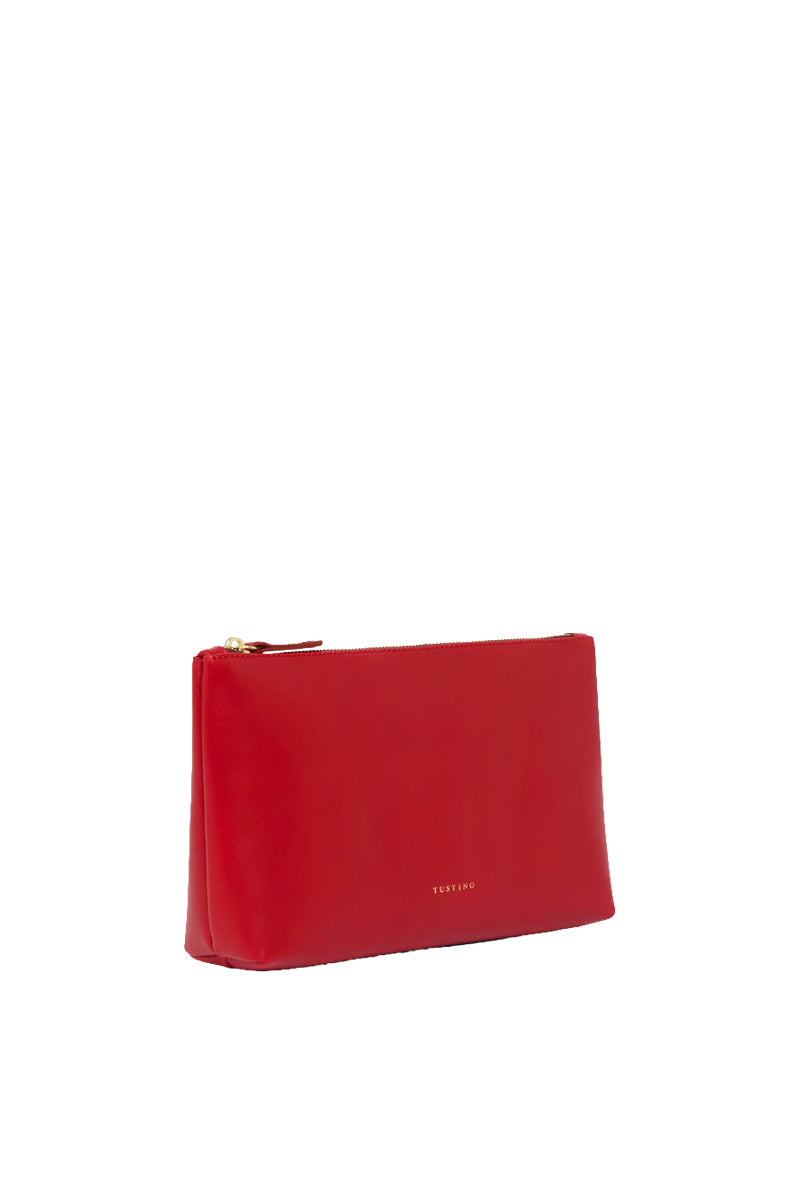 Crimson leather pouch with top handle, TUSTING brand, showcasing smooth texture and compact design for stylish carry.