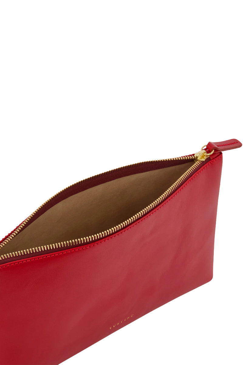 Crimson leather top handle pouch by TUSTING featuring a sleek, compact design with a sturdy handle and smooth finish.