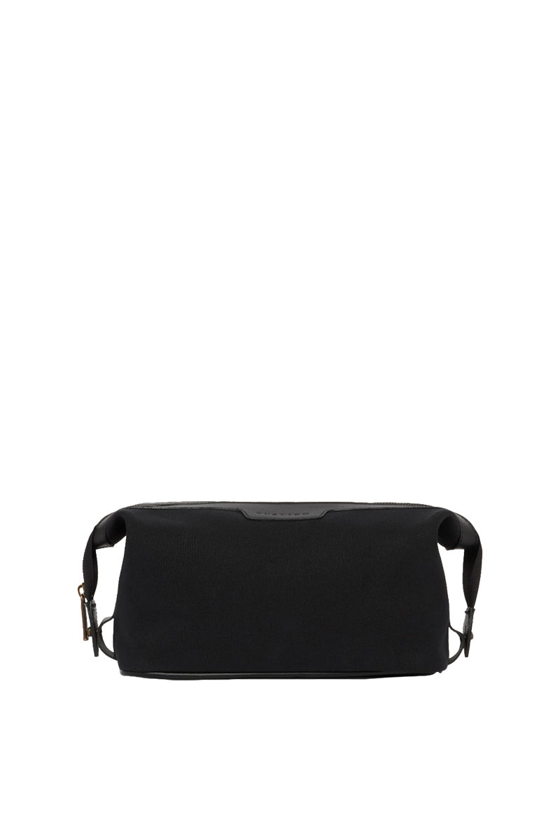 TUSTING Horizon canvas and leather top handle bag in Como canvas with black trim, featuring a stylish and functional design.