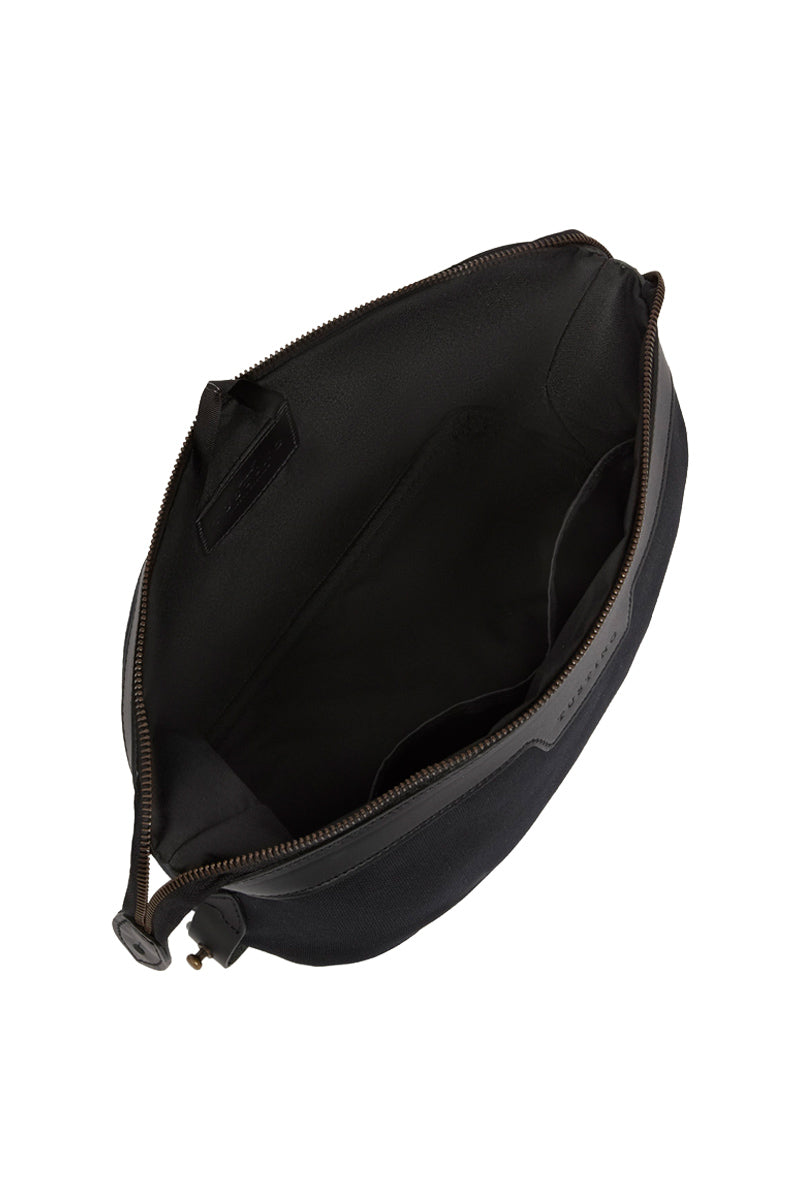 TUSTING Horizon canvas and leather top handle bag in Como canvas with black trim, featuring a structured design and top handle.