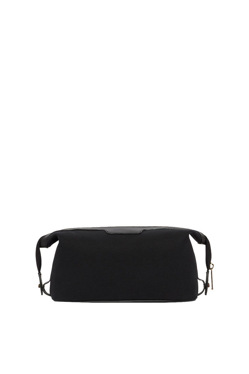 TUSTING Horizon canvas and leather top handle bag in Como canvas with black trim, featuring a stylish design and sturdy handle.