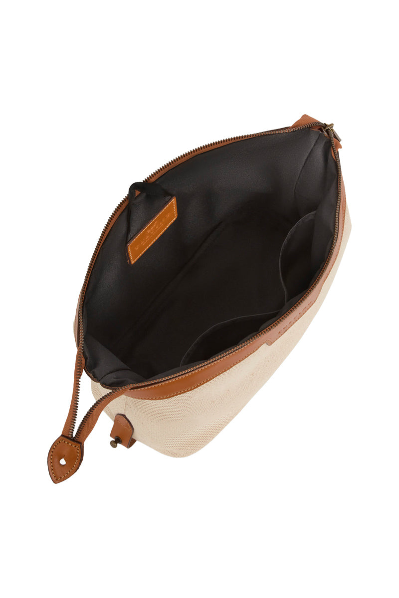 TUSTING Horizon canvas and leather top handle bag in Como canvas with tan trim, featuring a structured design and elegant detailing.