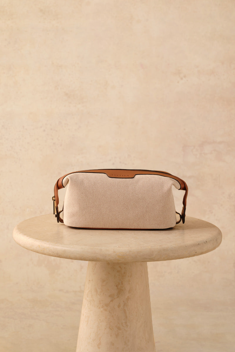 TUSTING Horizon canvas and leather top handle bag in Como canvas with tan trim, featuring a stylish and spacious design.