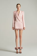 Light pink double-breasted blazer in taffeta fabric by I.H.F Studio, shown as an oversized blazer on a hanger.