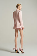 Light pink double-breasted blazer by I.H.F Studio, oversized fit, made of shiny taffeta fabric, styled for a modern look.