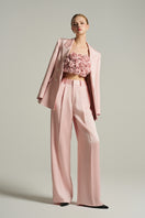 Light pink double-breasted blazer from I.H.F Studio featuring a tailored fit and classic lapels, shown on a mannequin.