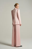 Light pink double-breasted blazer from I.H.F Studio featuring classic lapels and tailored fit, photographed on a neutral background.
