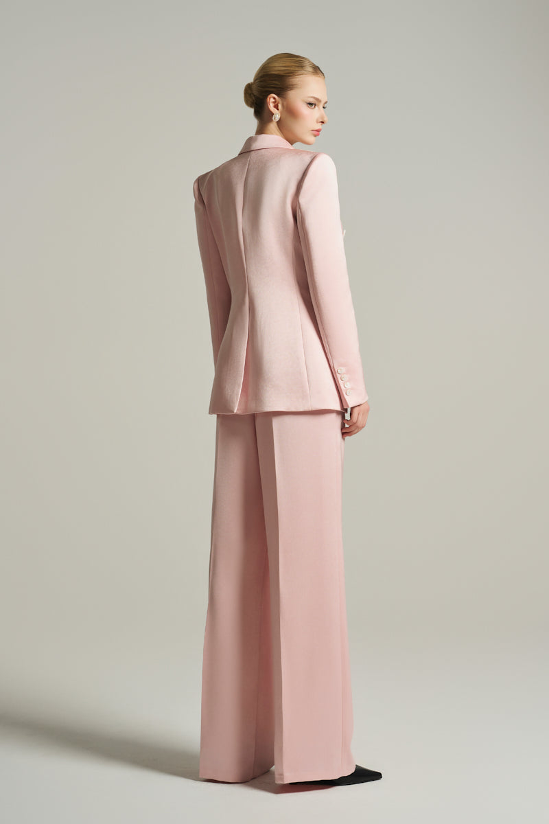 Light pink double-breasted blazer from I.H.F Studio featuring classic lapels and tailored fit, photographed on a neutral background.