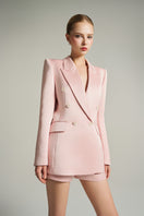 Light pink double-breasted blazer from I.H.F Studio featuring a tailored fit and classic lapel, displayed on a mannequin.