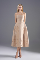 Beige taffeta A-line midi dress by Rosee de Matin, featuring a fitted bodice and flowing skirt, suitable for elegant occasions.
