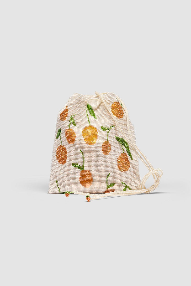 Beige Pura Utz shoulder bag with tangerine-colored pouch design, featuring a stylish and functional accessory.
