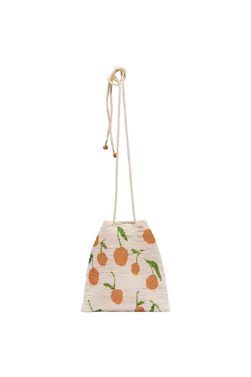 Beige Pura Utz shoulder bag with tangerine-colored pouch, stylish and compact for everyday use.