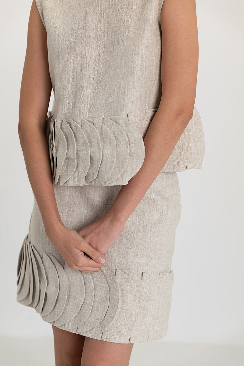 Cream-colored TATTI top by ANA + MARIA, lightweight sleeveless blouse with a relaxed fit, shown in sandy beige fabric.