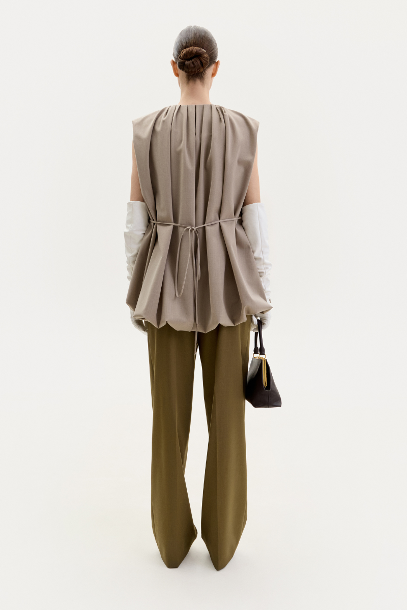 Taupe ELENAREVA vest with front zipper and waist belt, stylish sleeveless outerwear for casual or layered outfits.