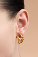 Gold TENA Emerald Studs Earrings by Fenomena featuring vibrant emerald green gemstones and sleek gold settings.