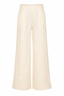 Yellow Terra pants by Ana + Maria displayed on a ghost mannequin, showcasing their relaxed fit and vibrant butter yellow color.