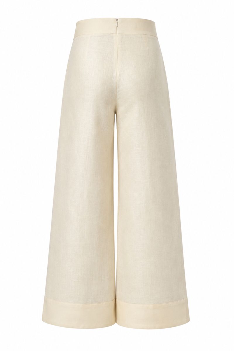 Yellow Terra pants by ANA + MARIA displayed on a mannequin, featuring a relaxed fit and vibrant butter yellow color.