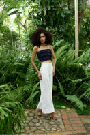 Light ivory Terra pants by ANA + MARIA displayed on a model, showcasing relaxed fit and stylish design.