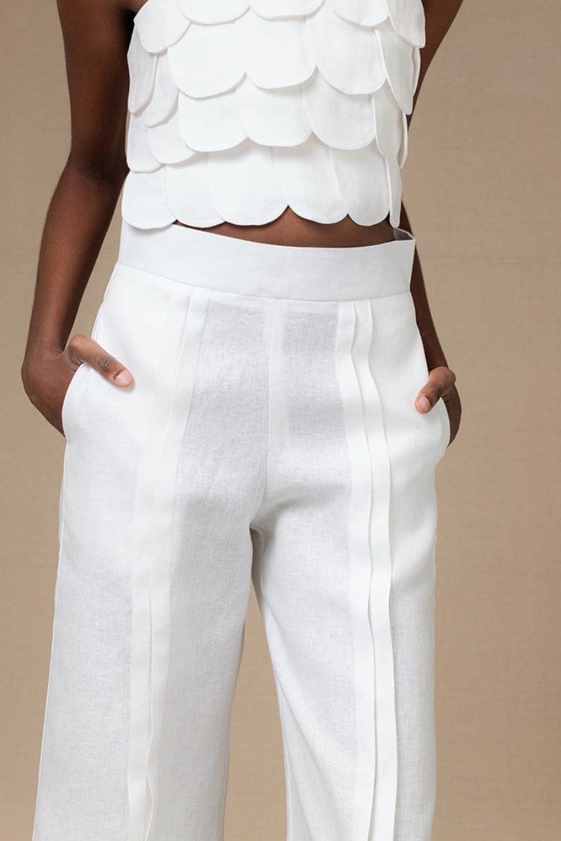 Light ivory Terra pants by ANA + MARIA displayed on a model, showcasing a relaxed fit and soft fabric.