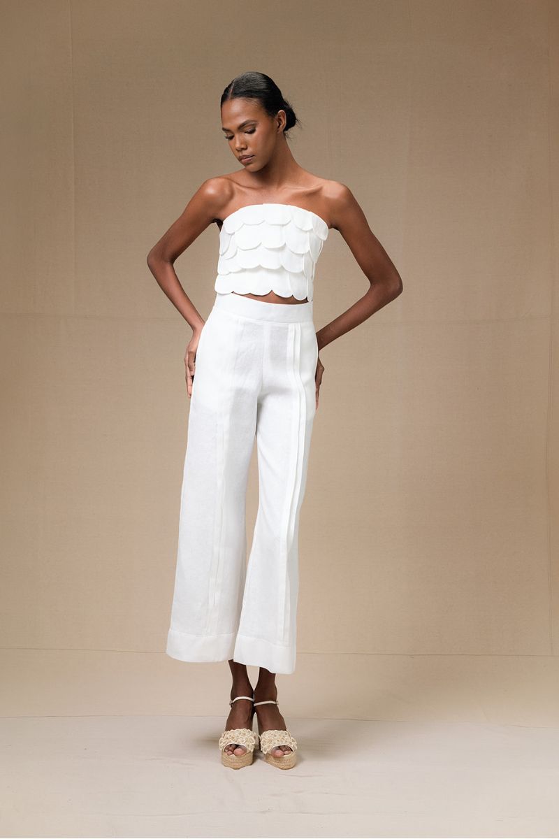 Light ivory Terra Pants by ANA + MARIA, shown on a model, featuring a relaxed fit and stylish design.