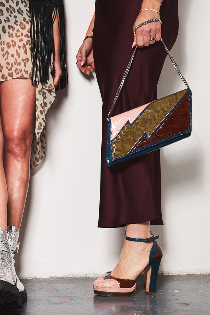 Terry de Havilland clutch bag inspired by 70s New York style, featuring bold design and vibrant colors.