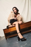 Black Zia mid heels by Terry de Havilland featuring sleek design and pointed toe, shown on a plain background.