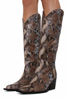Terry de Havilland cowboy boots in sandy beige leather with pointed toes and decorative stitching, stylish Western footwear.