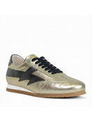 Terry de Havilland gold and black jogger bolt sneaker with flat design and sleek style, showcasing the stylish footwear.